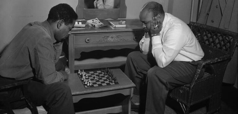 Carl J. Henniger, Jazz trumpeter, Dizzy Gillespie plays a game of chess backstage, Portland, 1954