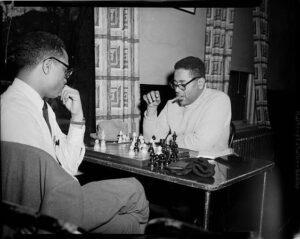 Playing chess | Dizzy Gillespie, 1954 - 58 4 Playing chess | Dizzy Gillespie, 1954 - 58 Harold Keith playing chess with jazz musician Dizzy Gillespie