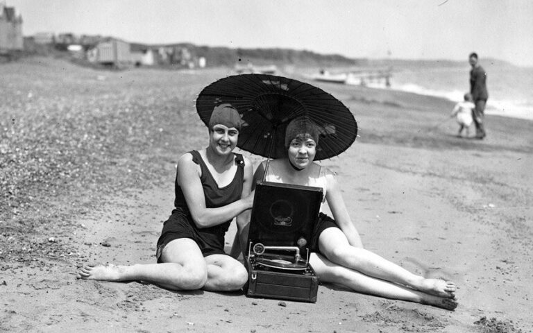 on the beach listening to a gramophone, 1930s