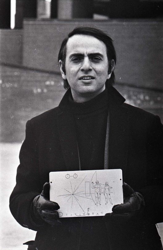 Jeff Albertson Carl Sagan with a copy of the plaque that flew with the Pioneer space probes in Boston March 1972