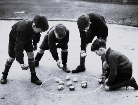 Four enterprising boys evacuated from Stoke Newington London to Hertfordshire use Easter eggs to play a game of marbles 1940