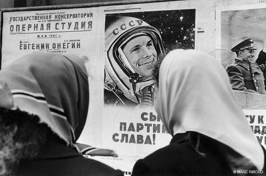 Women looking at posters celebrating Yuri Gagarins space flight. Photo by Marc Riboud Moscow April 1961