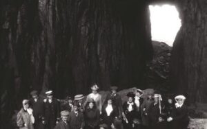 Anders Beer Wilse, A group of people in the hole at Torghatten, Norway, 1907